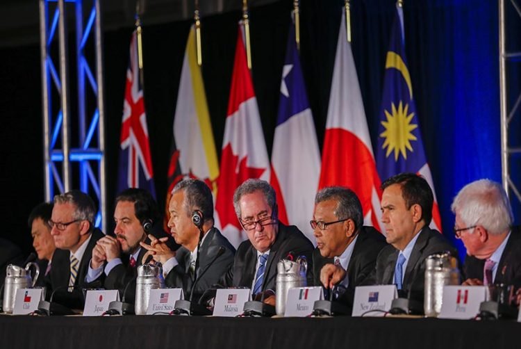 epa04964748 United States Trade Representative Michael Froman (C) is flanked by international counterparts during the closing press conference after an agreement was reachef by twelve Trans-Pacific Partnership (TPP) member countries, in Atlanta, Georgia, USA, 05 October 2015. Twelve Pacific Rim countries reached an agreement 05 October on a trade pact that will lift most duties on trade and investment, set new business standards and protect intellectual property rights. The TPP countries include the United States, Australia, New Zealand, Canada, Mexico, Peru, Chile, Japan, Vietnam, Malaysia, Singapore and Brunei.  EPA/ERIK S. LESSER
